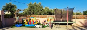 a childrens play park with a playground at Villa Eleanna Pastras Residence in Vanáton