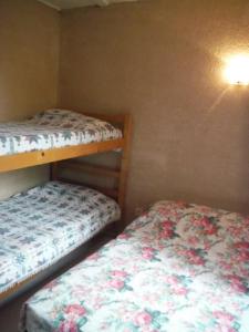 a room with two bunk beds in a room at Camping Europa Beach in Castellare-di-Casinca