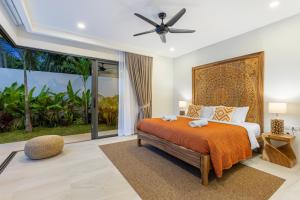 Ένα ή περισσότερα κρεβάτια σε δωμάτιο στο Villa Jungle Jem Tropical Garden +66 φωτογραφίες