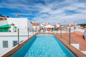 a swimming pool on the roof of a building at AL-Odeceixe Verde in Odeceixe