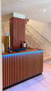 a colorful bar in a room with stairs at Hotel Milazzo Smart in Milazzo +69 photos