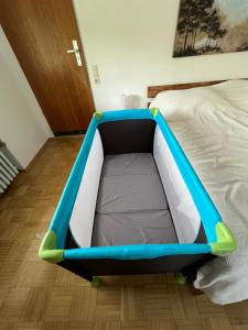 a bed with a blue and white bed frame at Kirchheim Hessen in Kirchheim