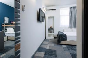 Postel nebo postele na pokoji v ubytování Amarant Stay by CHM