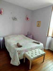 Ένα ή περισσότερα κρεβάτια σε δωμάτιο στο Le Relais de la Bulle Enchantée