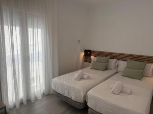 Postel nebo postele na pokoji v ubytování EDIFICIO La Botica de Enrique by Málaga Planners