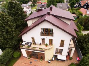 an aerial view of a house with a roof at Po Jūros Banga in Palanga