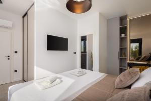 Ένα ή περισσότερα κρεβάτια σε δωμάτιο στο Villa Harmony +55 φωτογραφίες