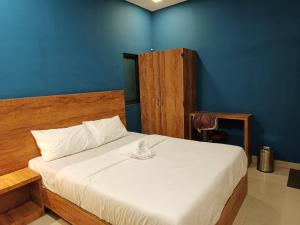 Ένα ή περισσότερα κρεβάτια σε δωμάτιο στο Hotel West Side Stay +1 φωτογραφίες