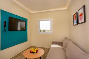 a living room with a couch and a table at MIA Urban Agadir in Agadir