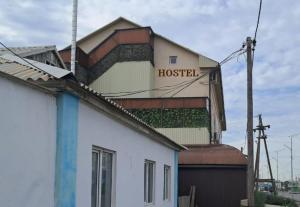 a building with a hospital sign on top of it at Premium Hostel Atyrau in Atyrau