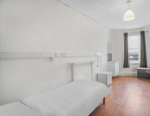 Ένα ή περισσότερα κρεβάτια σε δωμάτιο στο Halpin House (South Kensington)