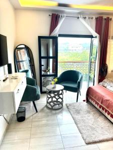 Ένα ή περισσότερα κρεβάτια σε δωμάτιο στο Maison spacieuse, sécurisée et climatisée