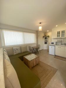 a living room with a couch and a table at סוד הנחלים in Sede Neẖemya
