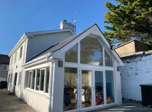 an extension to a house with sliding glass doors at Enniscrone House in Enniscrone