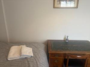 Ένα ή περισσότερα κρεβάτια σε δωμάτιο στο The Hardy Room