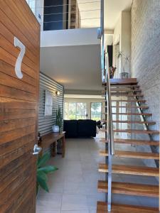 a staircase leading to the living room of a house at Pikes Point Beach House in Merimbula
