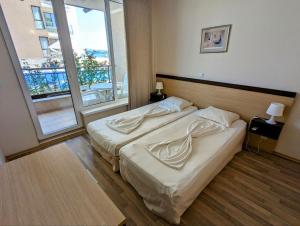 Ένα ή περισσότερα κρεβάτια σε δωμάτιο στο Obzor Beach Resort F001 Urlaub BG