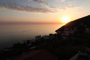 a sunset over the ocean from a hill at Captain's View in Dobra Voda