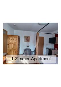 a view of a room with a kitchen and a dining room at Ferienwohnung Kugel in Landau in der Pfalz +5 photos