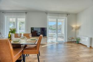 a dining room with a table and chairs at Villa Lucija - perfectholiday in Biograd na Moru