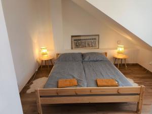 a bedroom with a bed with two lamps on both sides at Kralovak in Králŭv Dvŭr +18 photos