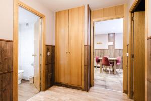a bathroom with a table and a dining room at Apartaments La Neu-Mountain Lodges & Restaurant in Ordino +176 photos