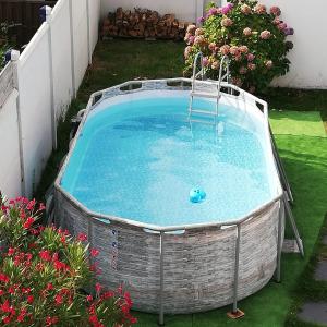 a pool with a ball in the middle of a yard at L'AUTHENTIQUE - 600m plage - Piscine in Saint-Nazaire