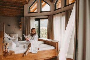 Postel nebo postele na pokoji v ubytování Hotel Rosenhof Murau