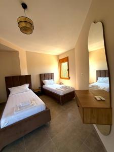 Postel nebo postele na pokoji v ubytování Kolagji Villas