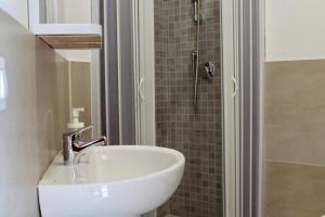 a bathroom with a sink and a shower at B&b Biagio 2 Managed by Calabria Mare Experience in Cirella +83 photos