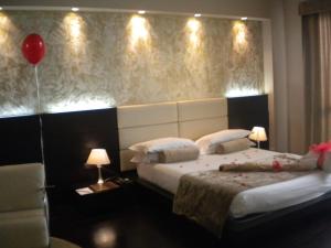 Voodi või voodid majutusasutuse OneMhotel toas