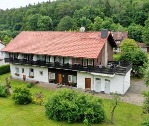 an aerial view of a house with a red roof at Ferienappartements Haus Jörn in Wieda