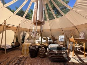 a room with a tent with a bed in it at Bramslev Bakker Naturhotel in Hobro