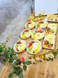 a bunch of plates of food on a table at Easy Comfort Hostel in Tashkent