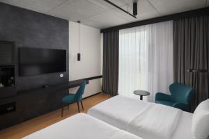 TV a/nebo společenská místnost v ubytování Pullman Zagreb