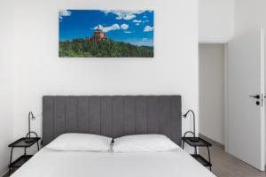 Ένα ή περισσότερα κρεβάτια σε δωμάτιο στο Urban Nest Artigiano House