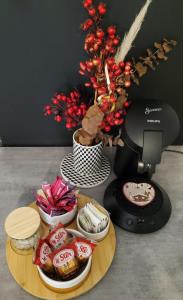 a table with a plate of food and a food processor at Studio au cœur de Laguiole in Laguiole