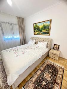 a bedroom with a large bed with a rug at Vila Premium Iasi in Iaşi
