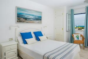 Ένα ή περισσότερα κρεβάτια σε δωμάτιο στο Bungalow 2 - Caleta Campos