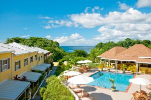 an aerial view of a resort with a swimming pool at Grooms Beach Villa & Resort in Saint Georgeʼs