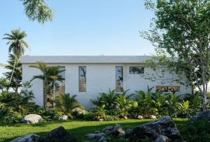 a white house with palm trees in front of it at KUUL Villas in Baan Tai