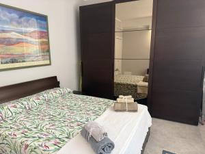Ένα ή περισσότερα κρεβάτια σε δωμάτιο στο Casa Simonetta