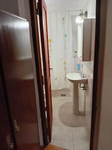 a bathroom with a sink and a toilet and a shower at Cabañas Silvia Banegas in Santa Rosa de Calamuchita