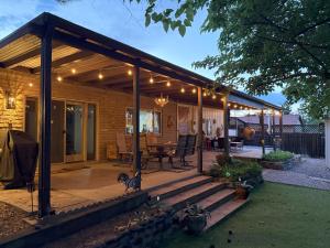a pavilion with a table and chairs on a patio at Casa Invierno in Cottonwood +56 photos