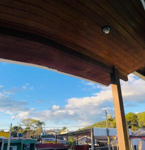 a view from the underside of a wooden structure at Casa próximo à praia Canasvieiras e ingleses in Florianópolis