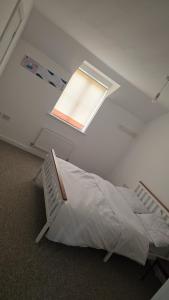 Voodi või voodid majutusasutuse Tranquil Haven Cottage toas