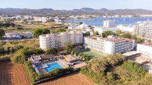 an aerial view of a resort with a pool and buildings at Invisa Hotel Es Pla - Adults Only in San Antonio