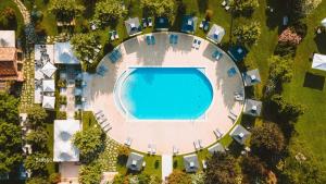 an overhead view of a large swimming pool in a resort at San Clemente Palace Venice in Venice