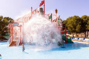 a water slide in a water park at Invisa Hotel Club Cala Verde in Es Figueral Beach