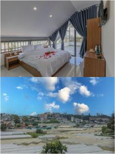a bedroom with a bed and a view of a city at Happy Home in Da Thanh